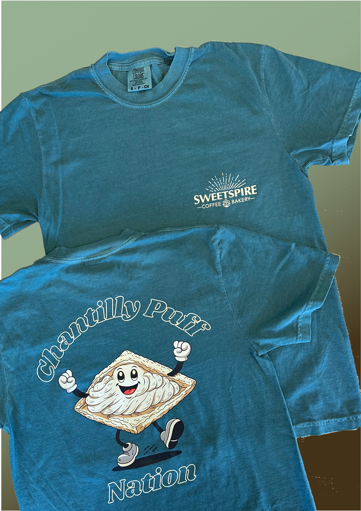 Blue t-shirt with 'Sweetspire' logo and 'Chantilly Puff Nation' design on a green background